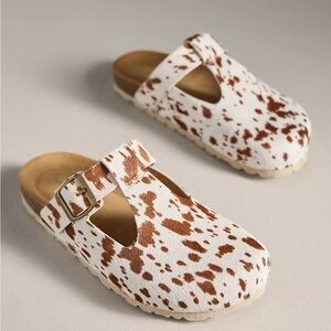 INTENTIONALLY BLANK Brown and White Clogs